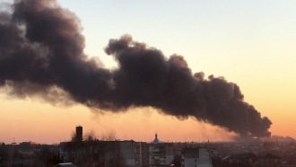 A cloud of smoke raises after an explosion in Lviv, western Ukraine.