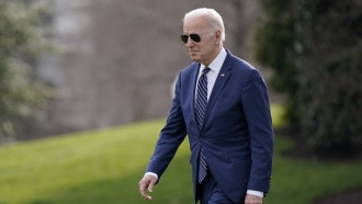 President Joe Biden walks on the South Lawn of the White House.