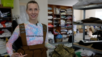 Sasha Glybina with a vest she helped create for Ukraine's military