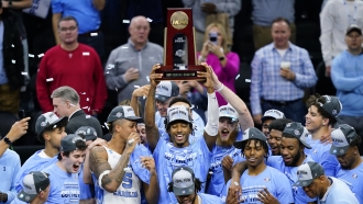 North Carolina players celebrate after North Carolina won their college basketball game against St. Peter's.
