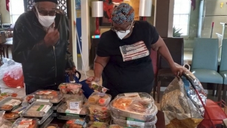 People picking out groceries from Second Servings of Houston.
