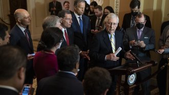 Senate Minority Leader Mitch McConnell speaks to reporters