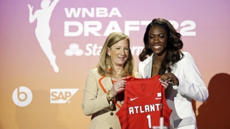 WNBA player Rhyne Howard poses for a photo with commissioner Cathy Engelbert after being selected by the Atlanta Dream.