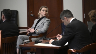 Actress Amber Heard looks on inside the courtroom