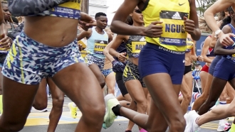 Elite women's runner Diana Kipyogei of Kenya breaks from the start in the center of the pack in the 125th Boston Marathon