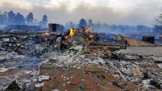 Arizona home destroyed by a wildfire on Tuesday.