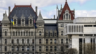The New York state Capitol building is shown next to the state appellate court building.