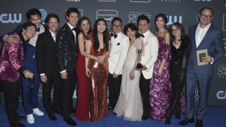 The cast and crew of "Crazy Rich Asians" pose in the press room.