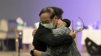 Two pastors embrace each other following a deadly church shooting