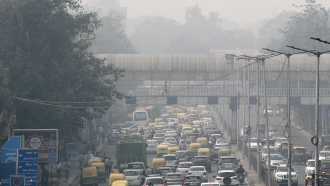 Vehicle traffic and dense smog in New Delhi, India.