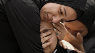 Palestinians mourn during the funeral of Amjad al-Fayyed, 17, in the West Bank refugee camp of Jenin