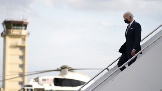 U.S. President Joe Biden disembarks from Air Force One on his arrival at Yokota Air Base.
