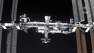 The international space station is seen from the SpaceX Crew Dragon spacecraft.