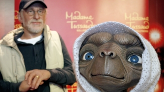 Wax figures of director Steven Spielberg and E.T. are displayed.