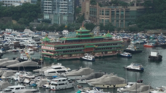 Hong Kong's iconic Jumbo Floating Restaurant is towed away.