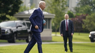 President Joe Biden walks on the South Lawn of the White House