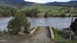 A washed out bridge shown along the Yellowstone River