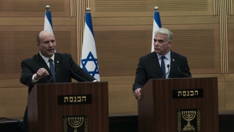 Israeli Prime Minister Naftali Bennett speaks alongside Foreign Minister Yair Lapid