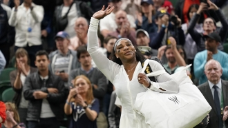 Serena Williams waves to the crowd at Wimbledon