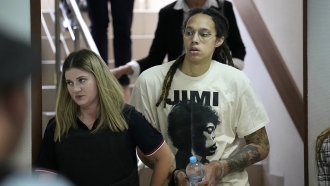 WNBA star and two-time Olympic gold medalist Brittney Griner is escorted to a courtroom for a hearing.