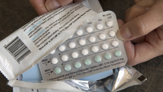 A one-month dosage of hormonal birth control pills is displayed.
