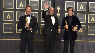 Patrick Wachsberger, from left, Fabrice Gianfermi, and Philippe Rousselet, winners of the award for best picture for "CODA."