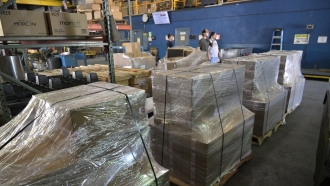 Pallets containing a shipment of 9mm SUB2000 rifles await shipment to Ukraine at the KelTec gun manufacturing facility