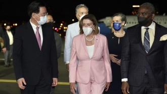 U.S. House Speaker Nancy Pelosi walks with Taiwan's Foreign Minister Joseph Wu as she arrives in Taipei, Taiwan.