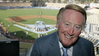 Los Angeles Dodgers broadcaster Vin Scully poses in the pressbox of Dodger Stadium