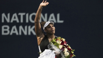 Tennis star Serena Williams waves to fans
