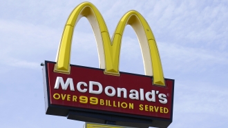A sign is displayed outside a McDonald's restaurant.
