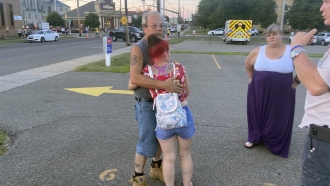 A man and a woman hug after a tragedy in Pennsylvania.