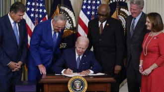 President Joe Biden signs the climate and health care bill