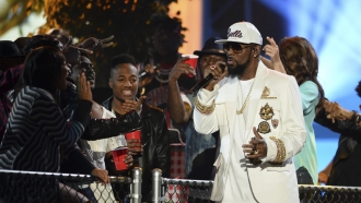 R&B singer R. Kelly performs at the 2015 Soul Train Awards