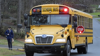 A Cobb County School bus moves on street