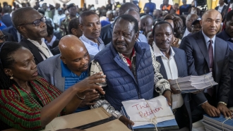 Presidential candidate Raila Odinga hands over the petition to the Supreme Court challenging the election results