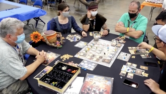 People play a board game.