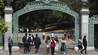 Students walk past Sather Gate on the University of California at Berkeley campus.