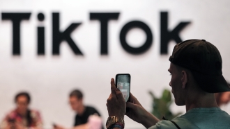 A visitor makes a photo at the TikTok exhibition
