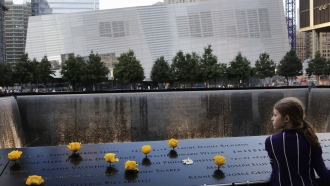 A child visits the National September 11 Memorial and Museum in New York