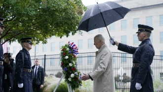President Joe Biden participates in a wreath laying ceremony while visiting the Pentagon.
