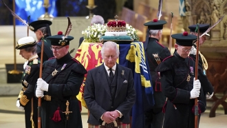 Britain's King Charles III, center, and other members of the royal family hold a vigil at the coffin of Queen Elizabeth II