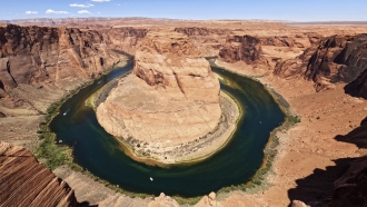 The Colorado River flows at Horseshoe Bend in Glen Canyon National Recreation Area