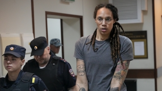 WNBA star and two-time Olympic gold medalist Brittney Griner is escorted from a court room in Russia.