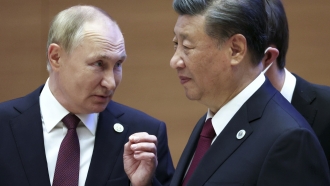 Russian President Vladimir Putin speaks to Chinese President Xi Jinping.