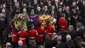 Britain's Queen Elizabeth II's coffin is carried inside Westminster Abbey during her funeral.