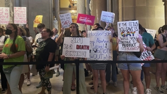 Abortion-rights protesters fill Indiana Statehouse corridors.