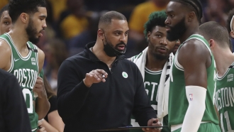 Boston Celtics head coach Ime Udoka talks with players.