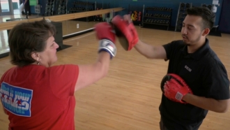 Catherine Renar and her boxing instructor