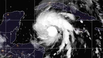 A satellite image of Tropical Storm Ian over the central Caribbean on Monday, Sept. 26, 2022